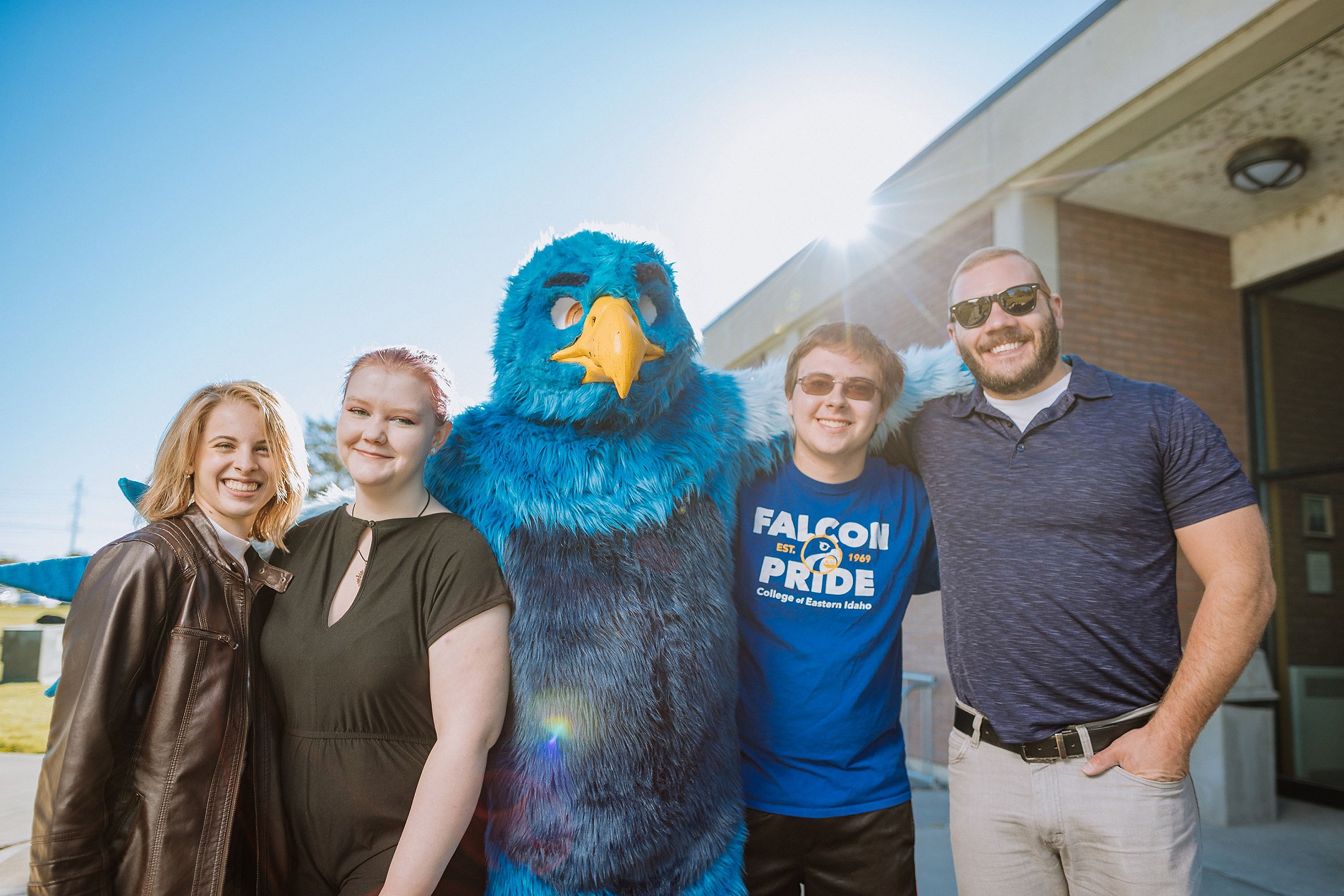 CEI banner image of students with  blue bird Mascot
