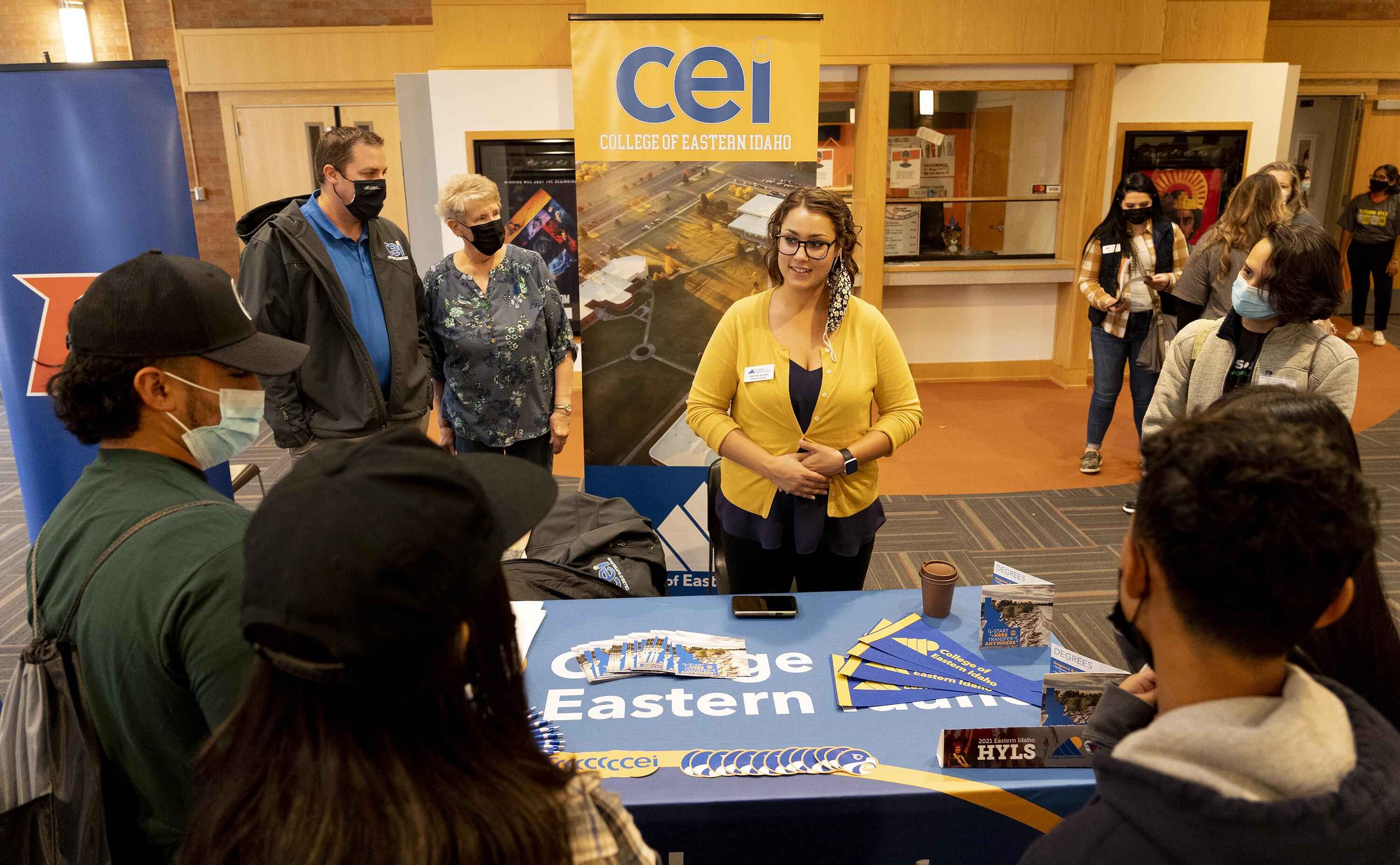 Students surrounding a CEI booth