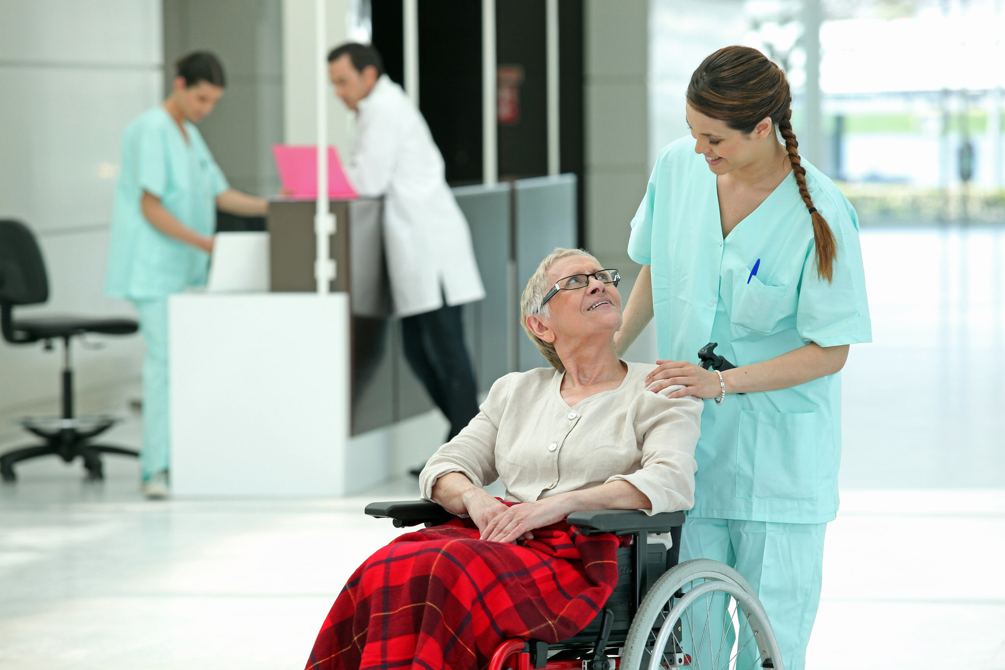 Nurse pushing wheelchair