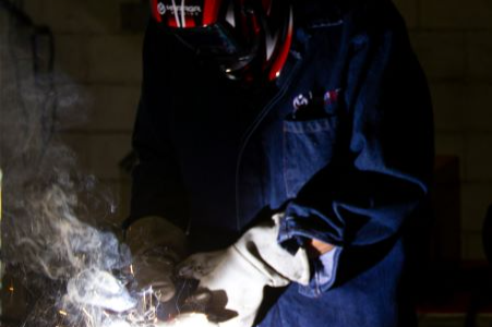 Worker in welding gear